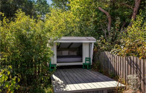 a gazebo with a bed on a wooden deck at Stunning Home In Nexø With Kitchen in Neksø