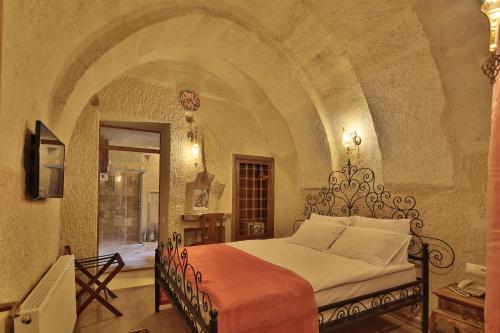Säng eller sängar i ett rum på Jacob's Cave Suites - Cappadocia