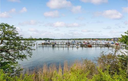 a dock with boats docked on a body of water at Beautiful Home In Gråsten With Wifi in Gråsten