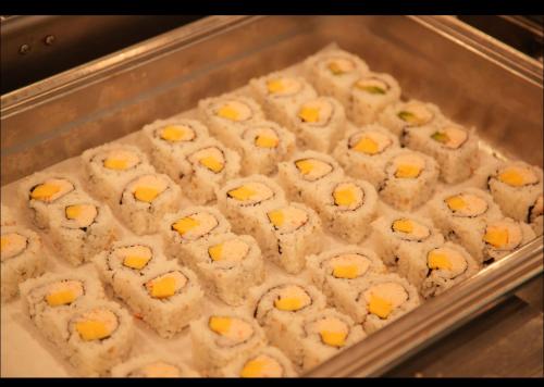 a tray of food with cheese on top at LA Crystal Hotel -Los Angeles-Long Beach Area in Carson