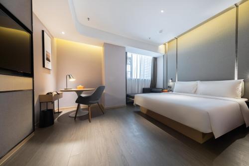 Ένα ή περισσότερα κρεβάτια σε δωμάτιο στο Atour Hotel Kunming Economic Development Zone
