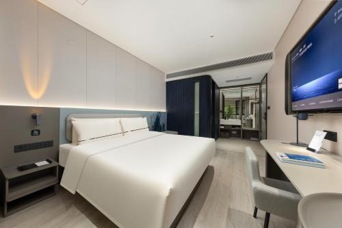 Postel nebo postele na pokoji v ubytování Atour Light Hotel Guangzhou Taikoo Hui Grand Plaza