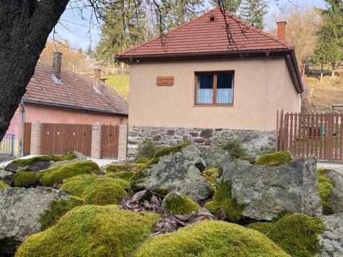 a house with a garden of mossy rocks at Pilis lelke vendégház in Esztergom