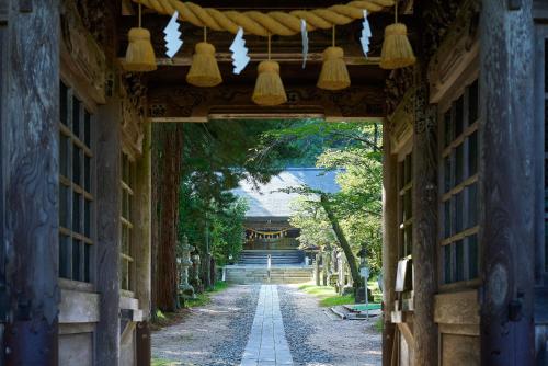 an alleyway leading into a building with lights at Azumino Komorebi - 安曇野こもれび - in Azumino