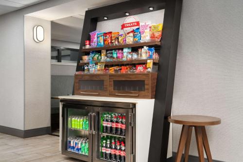 a drink station in a store with a drink cooler at Hampton Inn Roanoke/Hollins - I-81 in Roanoke