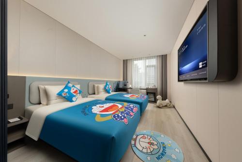 Un ou plusieurs lits dans un hébergement de l'établissement Atour Light Hotel Guangzhou Taikoo Hui Zhengjia Plaza-Free shuttle bus to Canton Fair
