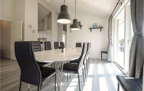a dining room with a table and chairs at Four-Bedroom Holiday Home In Haderslev in Haderslev