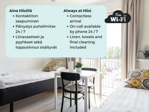 a bedroom with a bed and a table at Hiisi Homes Turku Fleminginkatu in Turku