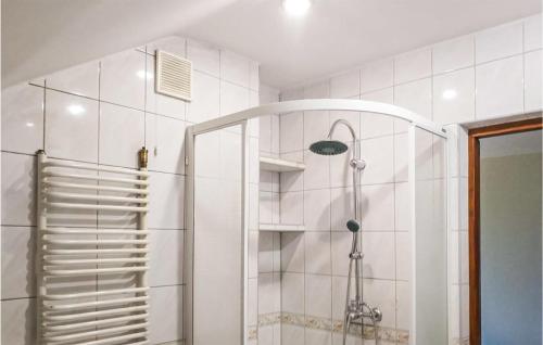 a shower in a bathroom with a glass door at 3 Bedroom Awesome Apartment In Klucze in Klucze