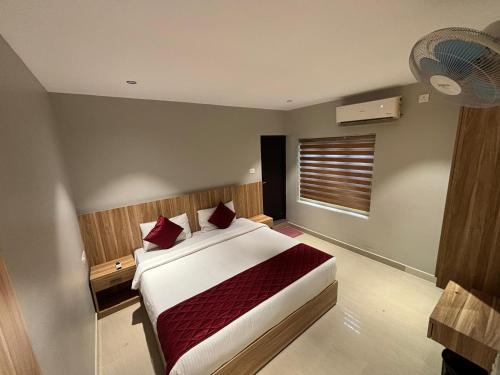 Katil atau katil-katil dalam bilik di Muziris Manor Residency