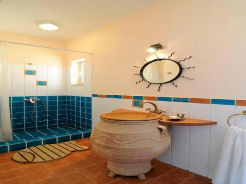 a bathroom with a toilet and a shower and a mirror at Stunning seafront apartment in Kea in Korissia