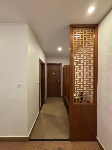 a hallway leading to a room with a door at Palette 823 Hotel Ichchha in Simara