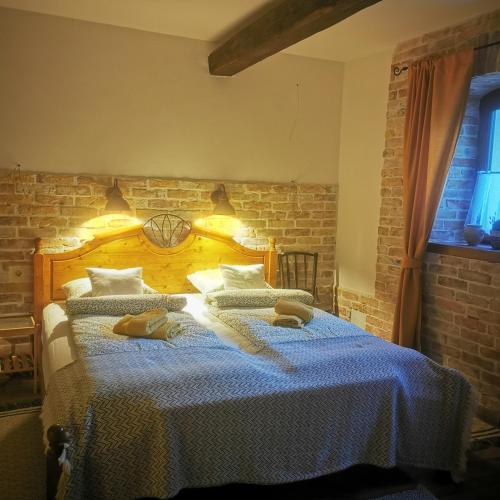 a bedroom with a bed with two towels on it at Kúria Apartman Private Wellness in Budapest