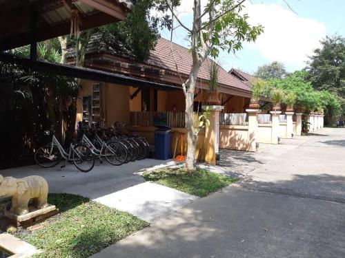 a group of bikes parked next to a building at Chalicha Resort in Chumphon