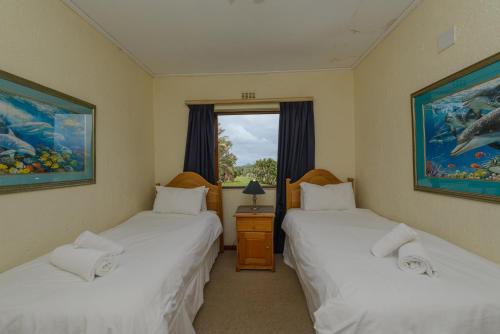 En eller flere senge i et værelse på San Lameer Villa 12407 - 2 Bedroom Standard - 4 pax - San Lameer Rental Agency