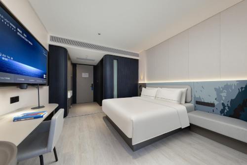Télévision ou salle de divertissement dans l'établissement Atour Light Hotel Guangzhou Taikoo Hui Zhengjia Plaza-Free shuttle bus to Canton Fair