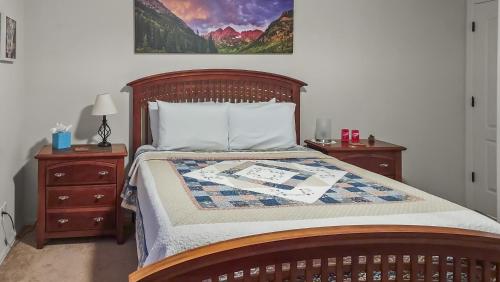 a bedroom with a bed with two nightstands and a bed sidx sidx sidx at Hermosa Haven home in Montrose