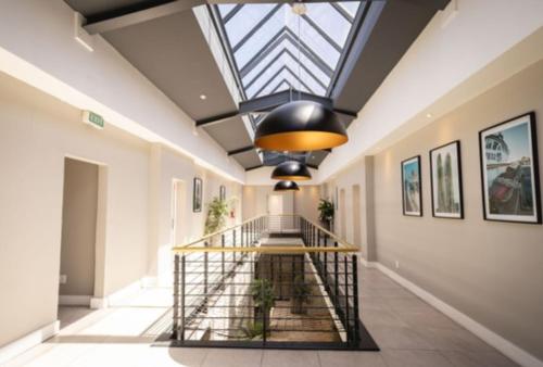 a hallway with a skylight and a glass ceiling at Ocean-View Studio Apartment, Hermanus Waterfront - Apt 8 in Hermanus