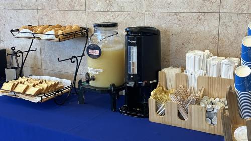 a drink in a blender sitting on a table with bread at Toyoko Inn Hirosaki Ekimae in Hirosaki