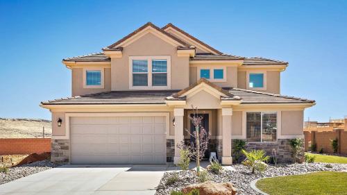 a house with a garage in front of it at House It Going home in Washington