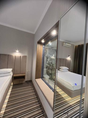 Postel nebo postele na pokoji v ubytování Sapar Standart Hotel