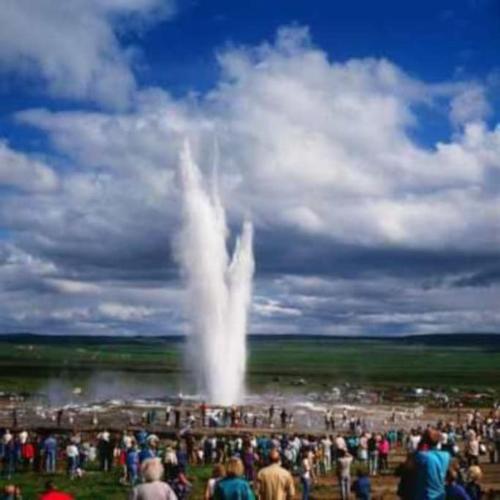 a large crowd of people standing around a fountain at Prime Location-Golden Circle 3 Bedrooms in Selfoss