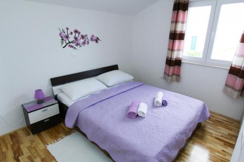Postel nebo postele na pokoji v ubytování Apartments Renato