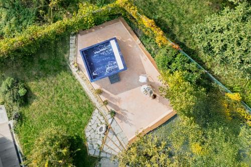an overhead view of a swimming pool in a yard at ASILO in BAROLO in Barolo