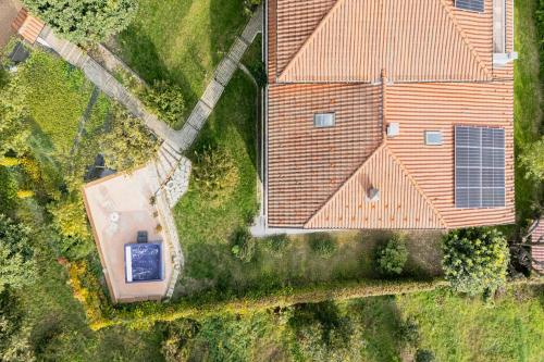 an overhead view of a house with a solar roof at ASILO in BAROLO in Barolo