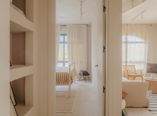 a room with a view of a living room at CASA MARTINA Apartamentos de diseño en Pozuelo in Pozuelo de Alarcón