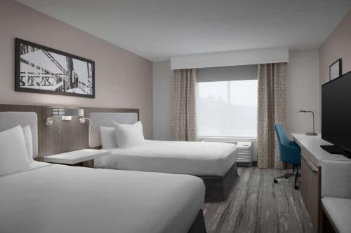 Ένα ή περισσότερα κρεβάτια σε δωμάτιο στο Hilton Garden Inn West Lafayette Wabash Landing