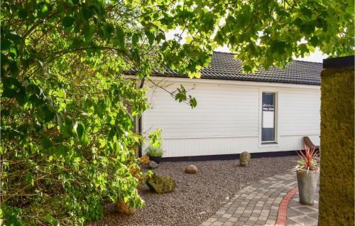 a white house with a driveway in front of it at Gorgeous Home In Borgholm With Wifi in Borgholm
