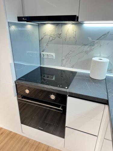 Η κουζίνα ή μικρή κουζίνα στο RentNow New Lux Business Apartment in the Center