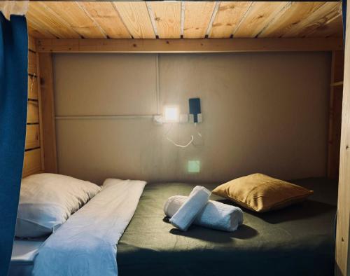a bunk bed with two pillows on top of it at Hostel Buddha in Chişinău