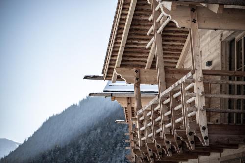 a stairway of a building with a view of a mountain at Valsegg Chalets Südtirol - luxury and private hideaway in Valles