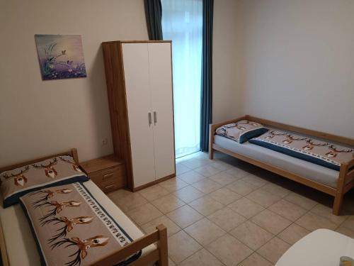 Postel nebo postele na pokoji v ubytování Ferienwohnungen Hebalm