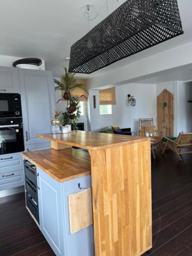 a kitchen with a wooden counter top in a room at VILLA LA PLAGE in Trouville-sur-Mer