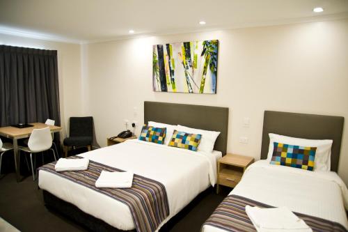 Ένα ή περισσότερα κρεβάτια σε δωμάτιο στο Roma Central Motel