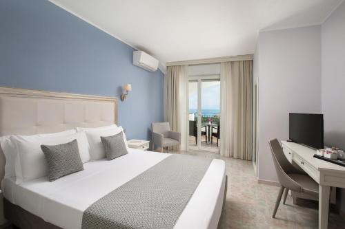 Postel nebo postele na pokoji v ubytování Hotel Rosa dei Venti