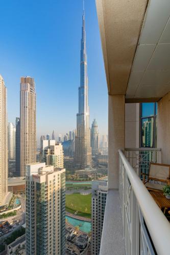 a view of a city skyline from a balcony at Luxury High Floor 1BR with Full Burj Khalifa View by Auberge in Dubai