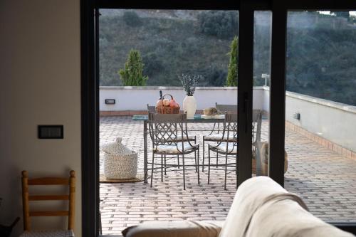 a view of a patio with a table and chairs at Villa Galiana By Florentia Homes in Toledo