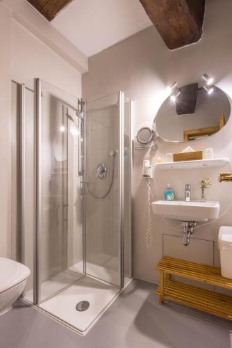 a bathroom with a shower and a sink at Hotel Meisnerhof in Erlabrunn