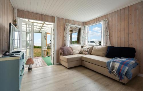 a living room with a couch and a window at Lovely Home In Hejls With Wifi in Hejls