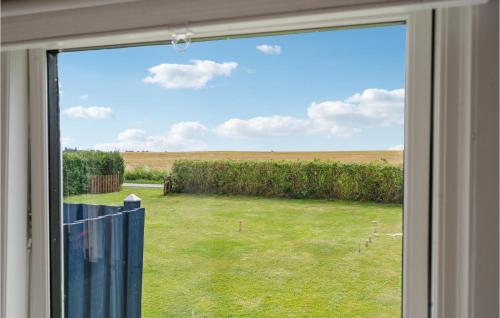 a window with a view of a field of grass at Lovely Home In Mesinge With Wifi in Mesinge