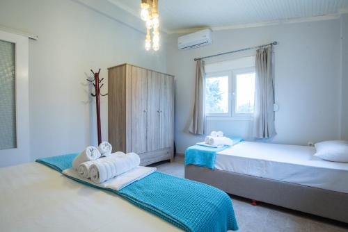 Postel nebo postele na pokoji v ubytování Villa Hara