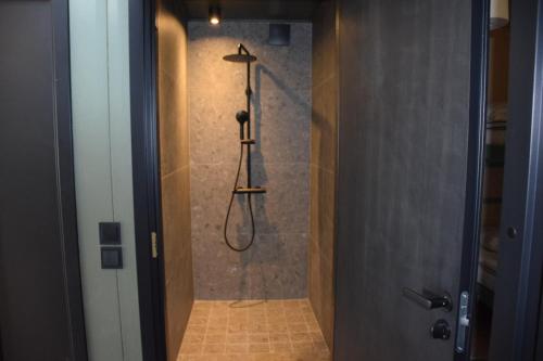 a shower stall in a bathroom with a shower at Ljungvind Funäsdalen in Funäsdalen