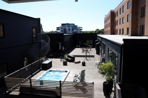 a balcony with a swimming pool on a building at Quality Hotel Vänersborg in Vänersborg