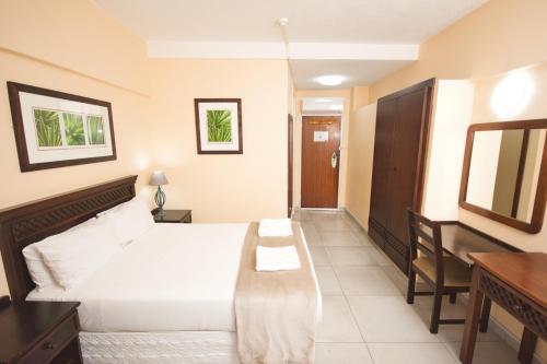 Letto o letti in una camera di Gooderson Tropicana Hotel