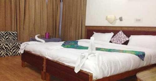Ένα ή περισσότερα κρεβάτια σε δωμάτιο στο SIT Hotel Ladakh Horizon Leh