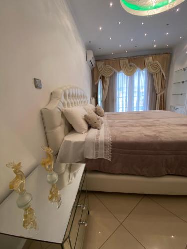 a bedroom with a large bed and a window at LaBelle Elite House in Aridaia,Lutra Pozar in Aridaia